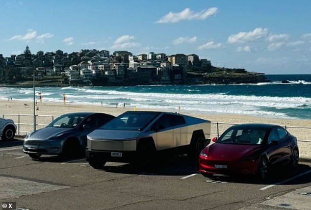 The shiny electric truck was spotted at several iconic Sydney locations including Bondi Beach (pictured)