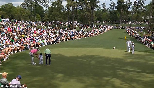 With the help of Bubba Watson (left), the youngster made a putt from across the green