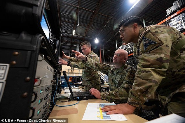 Space Force and Air Force personnel operate RMT equipment during a test of the new system.  The devices are designed to be deployed in large numbers and operated remotely.