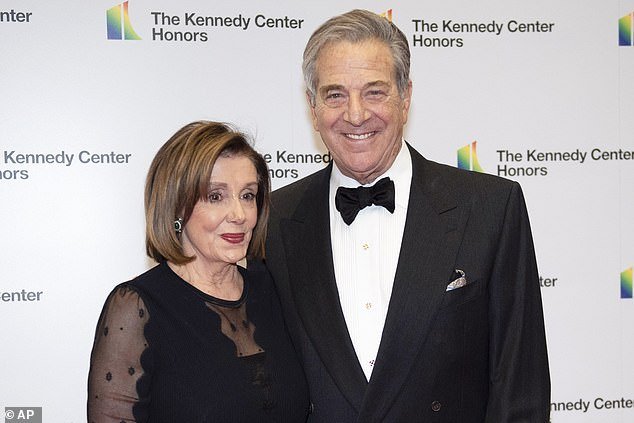 Former House Speaker Nancy Pelosi, D-Calif., poses with her husband Paul, an investment banker in San Francisco