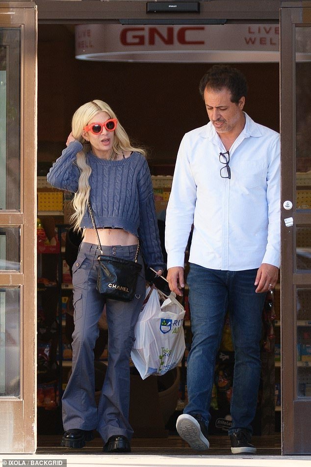 Tori Spelling was spotted shopping with a mystery man on Wednesday, days after filing for divorce from Dean McDermott