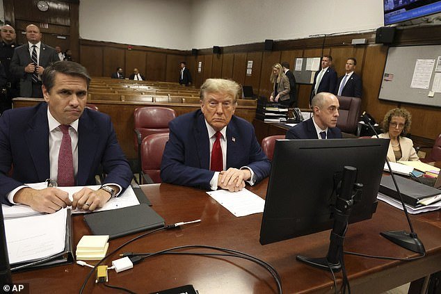 Trump with his legal team, from left to right: Todd Blanche, Emil Bove and Susan Necheles