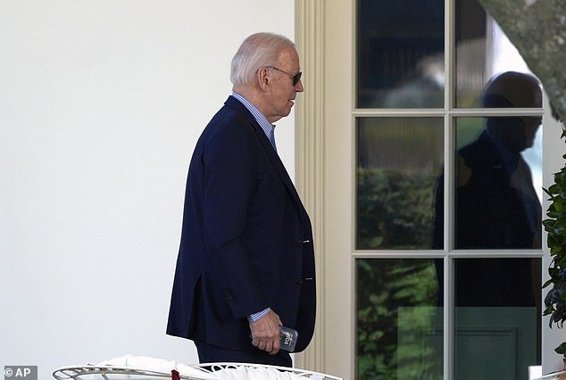 Biden is seen here walking to the Oval Office after returning from Delaware to consult with his national security team