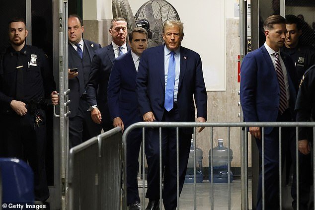 Former US President Donald Trump returns to the courtroom after a short break during his hush money trial at Manhattan Criminal Court on April 26, 2024 in New York Cit