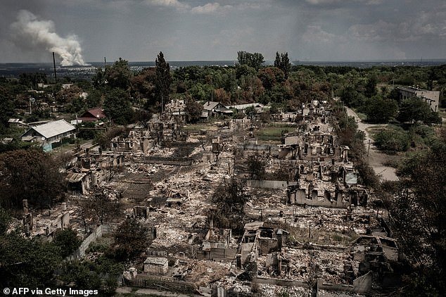 An aerial photo shows destroyed houses after a strike in the town of Pryvillya in the eastern Ukrainian region of Donbas on June 14, 2022