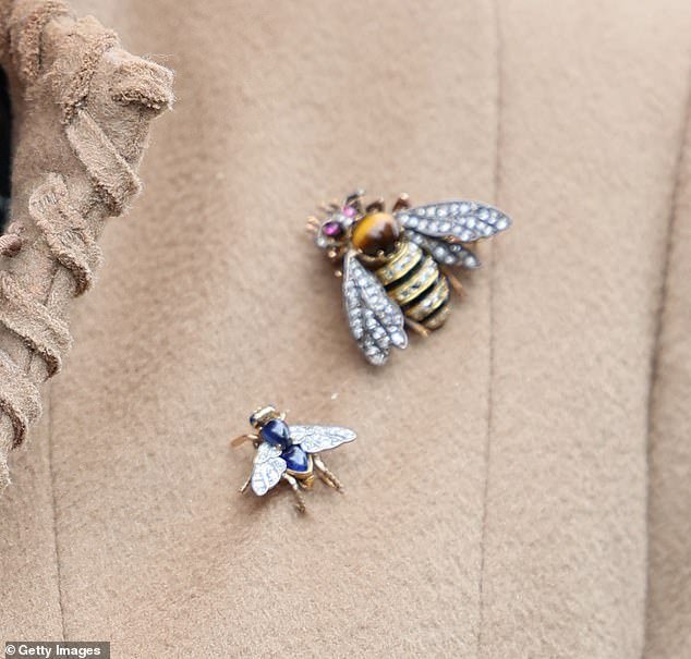 Just buzzing around... this very busy royal has a large bumblebee with rubies for eyes and a sapphire bee brooch that some might mistake for a bluebottle!