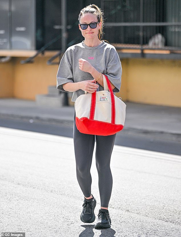 Olivia was spotted later on Tuesday wearing a gray short-sleeved shirt and skin-tight dark gray leggings as she left the Tracy Anderson Method Studio in LA after a workout session.