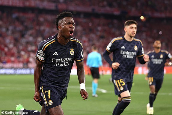 MUNICH, GERMANY - APRIL 30: Real Madrid's Vinicius Junior celebrates after scoring his side's second goal from the penalty spot during the UEFA Champions League semi-final first leg between FC Bayern Munich and Real Madrid at the Allianz Arena on April 30, 2024 in Munich, Germany.  (Photo by Alex Pantling/Getty Images) (Photo by Alex Pantling/Getty Images)