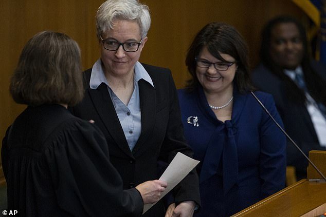 Kotek (pictured left) said she is awaiting guidance from the Oregon Government Ethics Commission to more clearly define her wife's (pictured right) long-term role