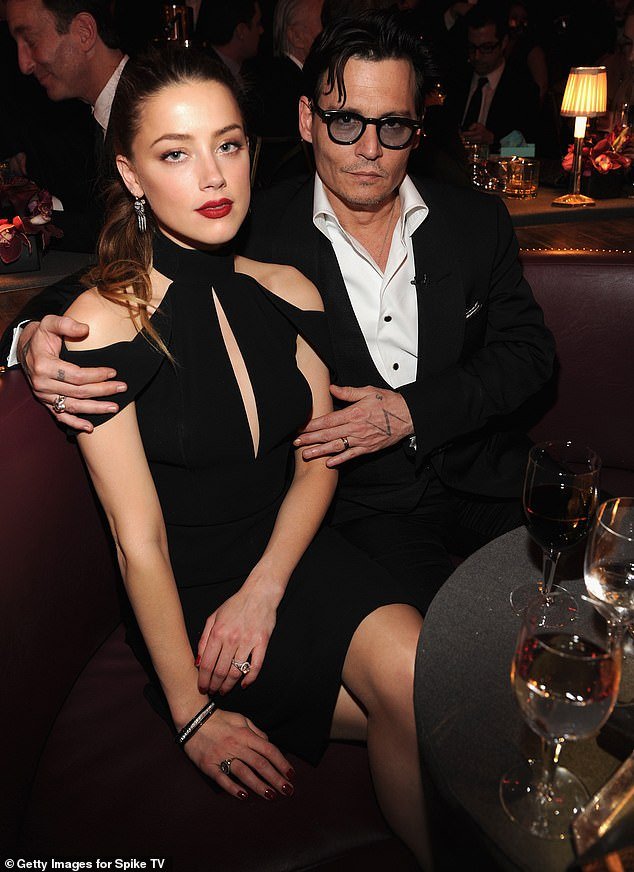 Depp, 60, spent years as a Hollywood pariah amid his highly publicized legal battles with ex-wife Amber Heard, 38;  they are pictured together in 2014