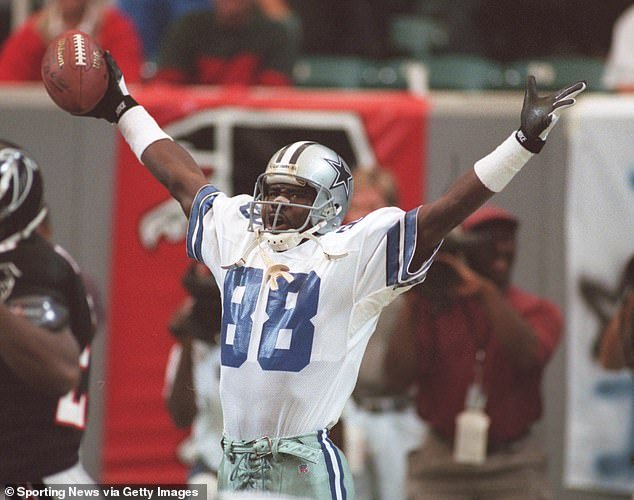Irvin is pictured celebrating a touchdown against the Falcons on October 29, 1995