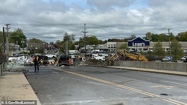 On Friday, crews began demolishing the damaged bridge using excavators