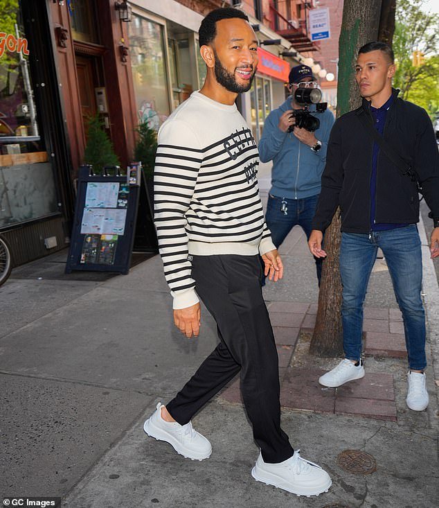 Meanwhile, Legend stayed comfortable in a striped crew-neck sweater, black pants and bright white sneakers as he spent time with his wife in New York.