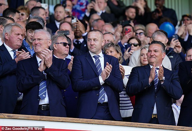 The directors of Ipswich Town look on with pride as their team returns to the top flight of English football