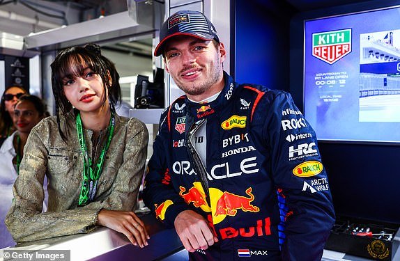 MIAMI, FLORIDA – MAY 05: Max Verstappen of Netherlands and Oracle Red Bull Racing poses for a photo with Lisa in the garage prior to the F1 Grand Prix of Miami at Miami International Autodrome on May 5, 2024 in Miami, Florida.  (Photo by Mark Thompson/Getty Images)