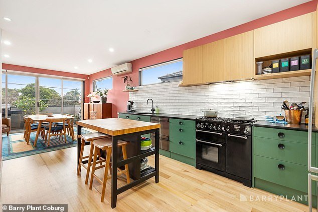 His biggest change came in the kitchen when Rhys had the space expanded into an 'expansive' space with green cupboards, pink walls and three ovens.