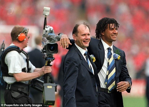 Williams is seen with Chelsea manager Ruud Gullit after they won the 1997 FA Cup final