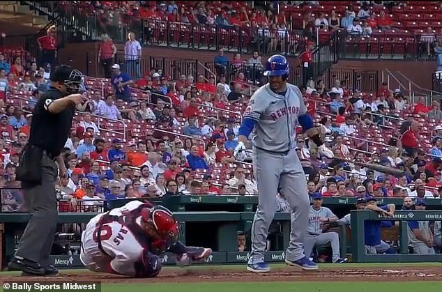 Contreras writhed around in pain after being accidentally clipped by Martinez's bat