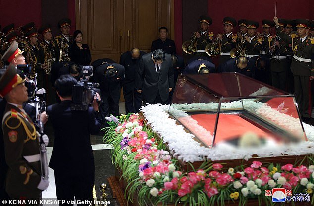 North Korean leader Kim Jong Un (C) and senior officials express their condolences to former Korean Workers' Party Vice Chairman Kim Ki Nam