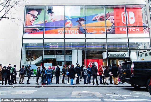 People wait in line outside the Nintendo Store in Manhattan, New York on March 3, 2017 – the worldwide release date of the original Nintendo Switch