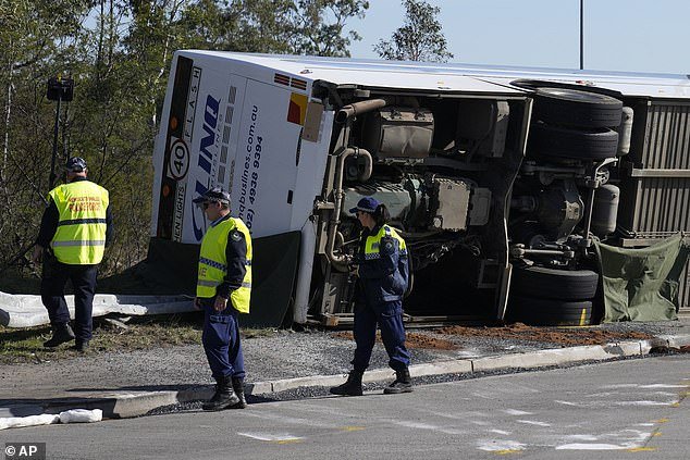 The bus (pictured) rolled onto its side after Button lost control while transporting wedding guests
