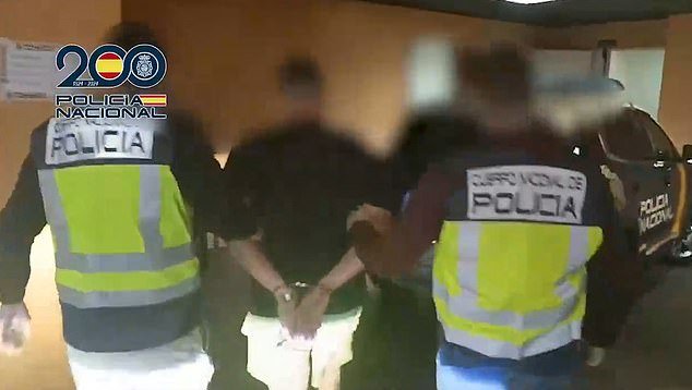 The video clip, shared by Policia Nacional, shows the man being led to a police station by two officers