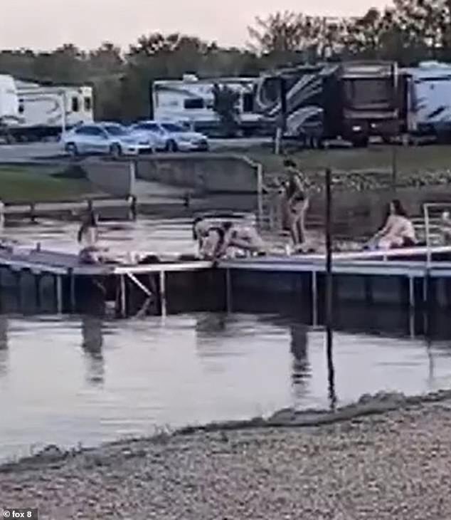 Video of the incident shows Gilbert's friends casually peering into the water as he fought for 20 minutes to save himself at the lake in Farmerville, Louisiana